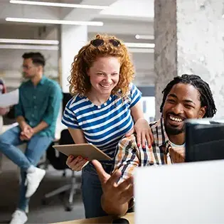 Group of business people in an office using devices
